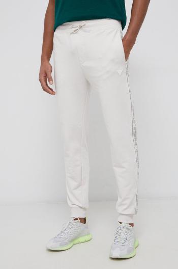Kalhoty Guess pánské, krémová barva, s aplikací