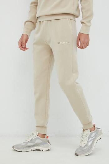 Kalhoty Guess pánské, béžová barva, s potiskem