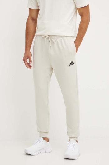 Tepláky adidas Essentials béžová barva, hladké, JH1039