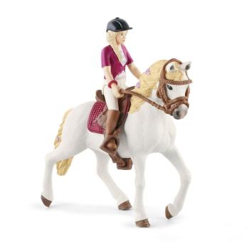 Blondýna Sofia s pohyblivými klouby na koni