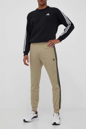 Tepláky adidas Originals béžová barva, s aplikací