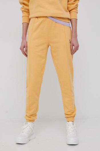 Kalhoty Karl Kani dámské, oranžová barva, hladké