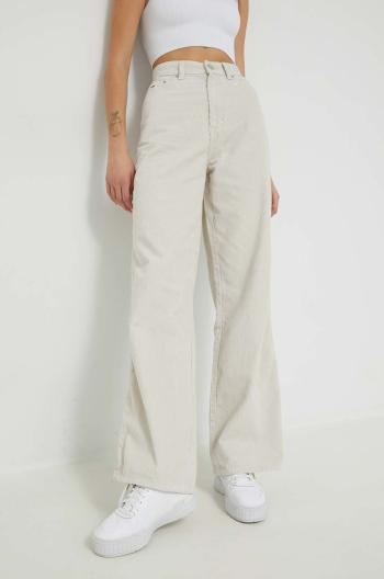 Bavlněné kalhoty Tommy Jeans Claire dámské, béžová barva, široké, high waist