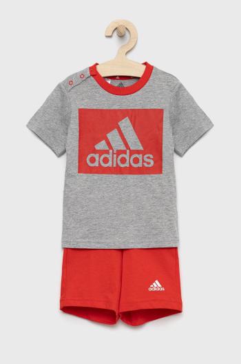 Dětská bavlněná tepláková souprava adidas červená barva