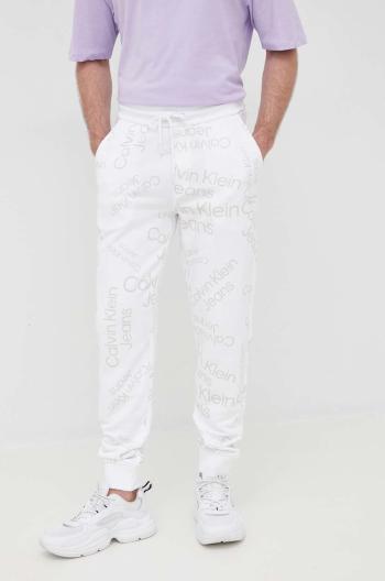 Bavlněné tepláky Calvin Klein Jeans pánské, bílá barva, vzorované