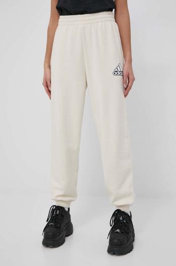 Bavlněné kalhoty adidas HC9175 dámské, béžová barva, s potiskem