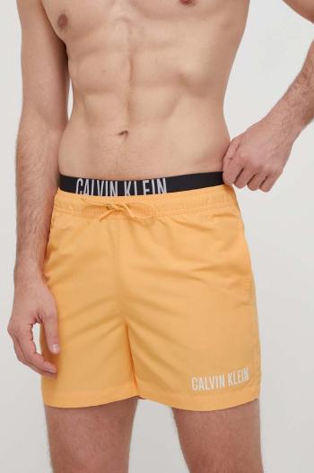 Plavkové šortky Calvin Klein oranžová barva, KM0KM00992