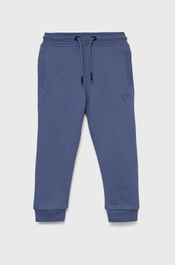 Dětské kalhoty Guess fialová barva, hladké