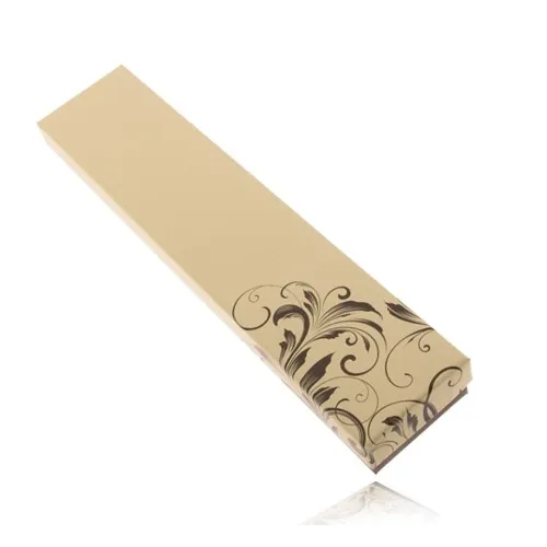 Krabička na řetízek hnědé a máslově žluté barvy, zakroucené listy