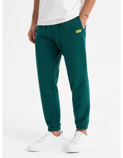 Pánské strukturované úpletové tepláky – zelené V5 OM-PASK-0211