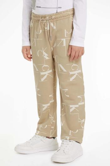 Dětské bavlněné tepláky Calvin Klein Jeans TERRY JOGGER béžová barva, IB0IB02124