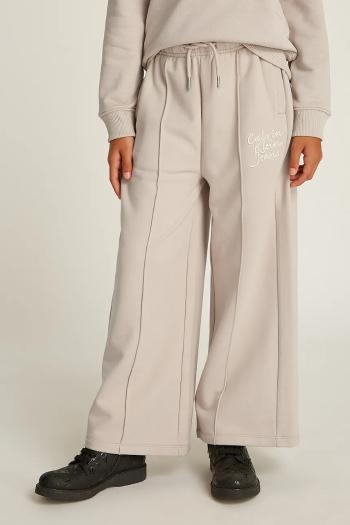 Detské tepláky Calvin Klein Jeans HANDW LOGO WIDE béžová farba, jednofarebné, IG0IG02775