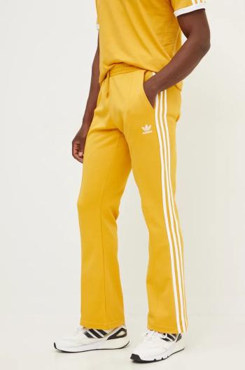 Tepláky adidas Originals 70S Track Pant žlutá barva, s aplikací, IX5223