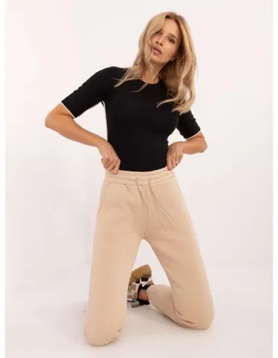 Dámské tepláky s kapsami béžové