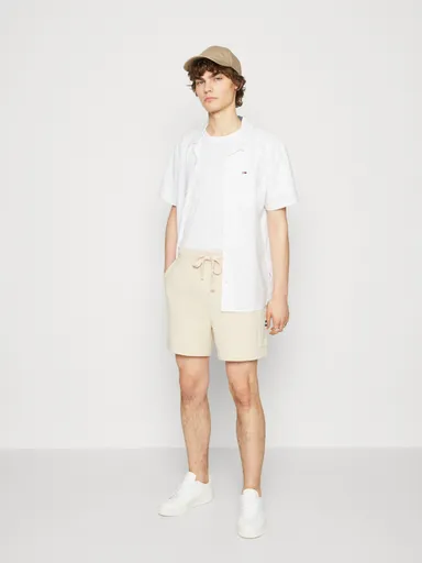 Tommy Jeans pánské béžové teplákové šortky DM0DM16330 L