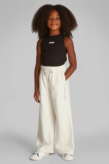 Detské tepláky Calvin Klein Jeans béžová farba, jednofarebné, IG0IG02876