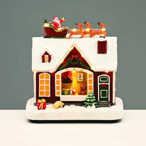 ACA Lighting Vánoční dekorace LED teplá bílá domeček se Santou a sáněmi s hudbou na baterie 3xAA 18x11x18,5cm X0357