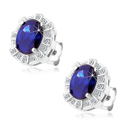 Rhodiované náušnice, stříbro 925, tmavomodrý oválný zirkon v ozdobném lemu